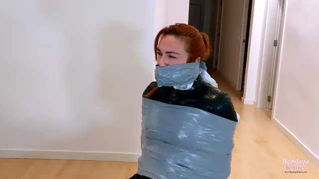 Poster: BONDAGEKITTIES - Girl In Leather Bound In Chair With Duct Tape By Roommate