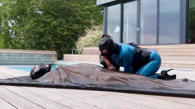 Poster: Cristal Kinky In Latex Catsuit Handjob And Fucking Bound Sub In Latex Vac Bed