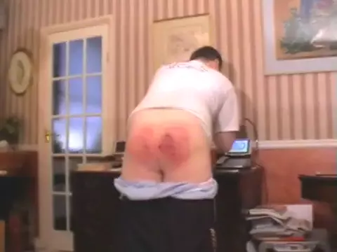 Poster: The guy's bottom is red from spanking